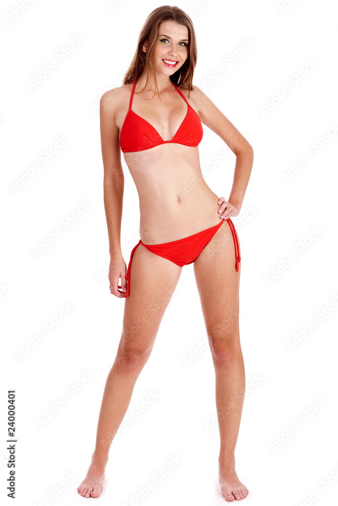 Full length of stunning woman in red bikini posing