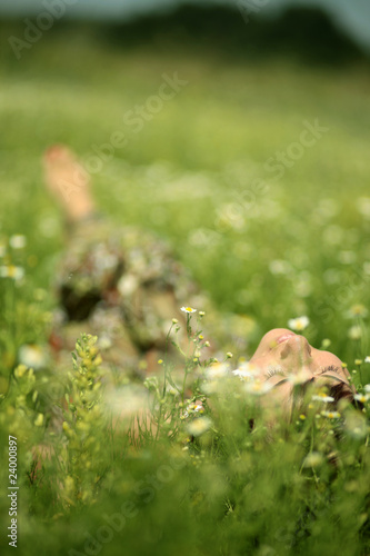 Woman lying on Meadow © zwolafasola