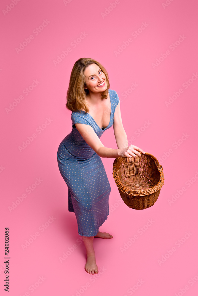 Fotografie Woman throwing wicker basket