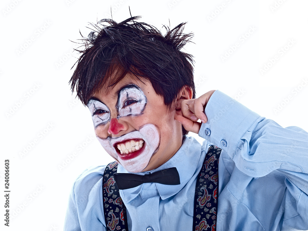 child clown covering his ear with his pointer finger child clown covering his ear with his pointer finger
