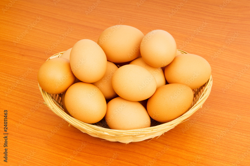 Basket of eggs on the colourful background Basket of eggs on the colourful background