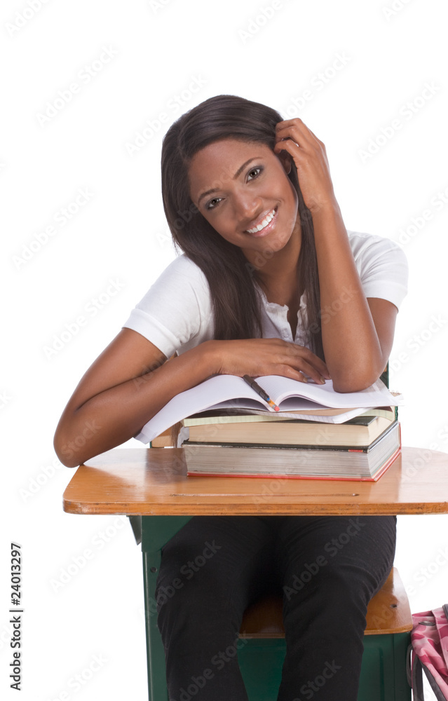 Black college student woman with book by desk Black college student woman with book by desk