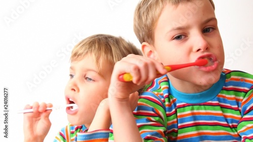 boy and girl brush teeth photo