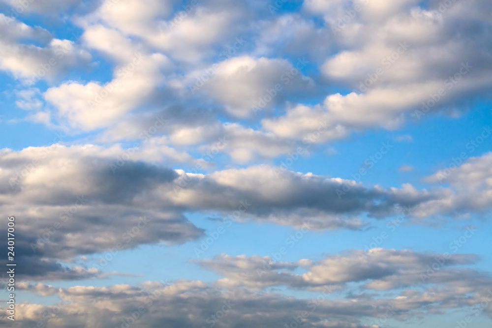 Clouds in the blue sunset sky Clouds in the blue sunset sky