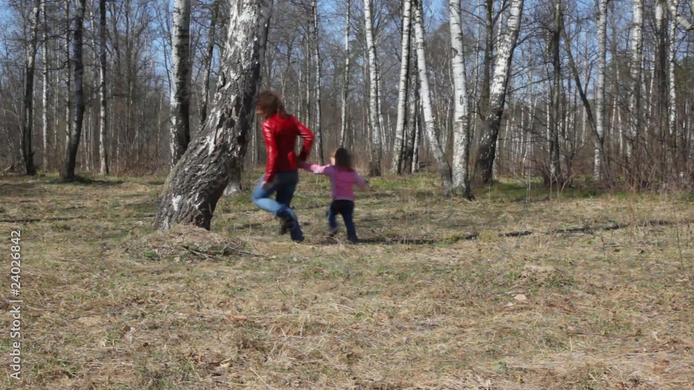 mother and daughter runs round the birch mother and daughter runs round the birch