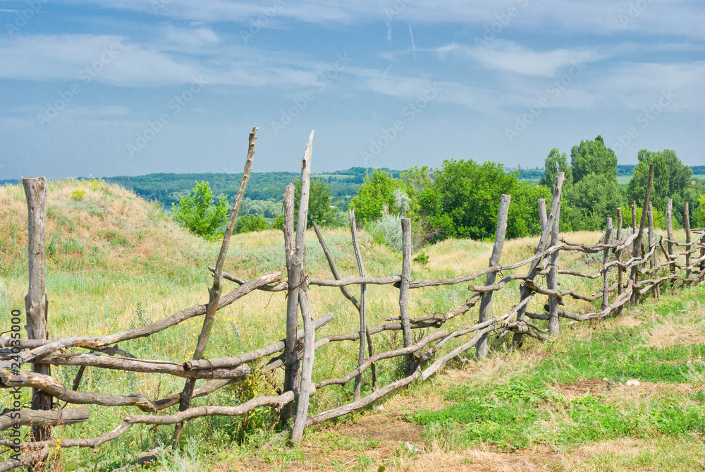 A country fence for cattle.