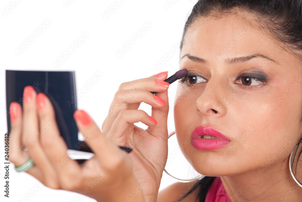 Beautiful woman applying makeup Beautiful woman applying makeup