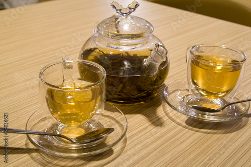 Teapot and cups with tea