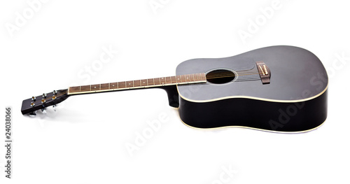 Elegance black shiny guitar isolated on white background photo