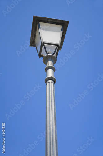 Street-lamp on blue sky.