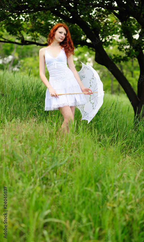 female standing on grass field female standing on grass field