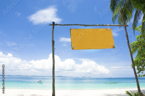 blue beach with signboard
