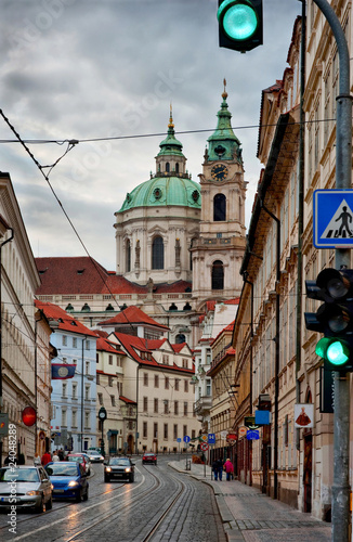 Canvas Print Street of Prague with baroque Saint Nicolas church