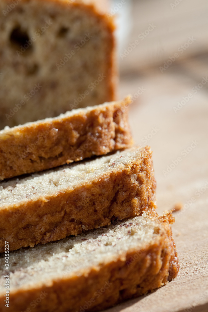 Delicious freshly baked banana bread on wooden board Delicious freshly baked banana bread on wooden board