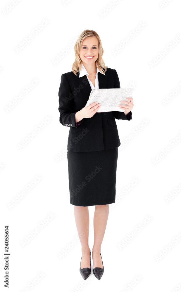Delighted businesswoman holding a newspaper Delighted businesswoman holding a newspaper