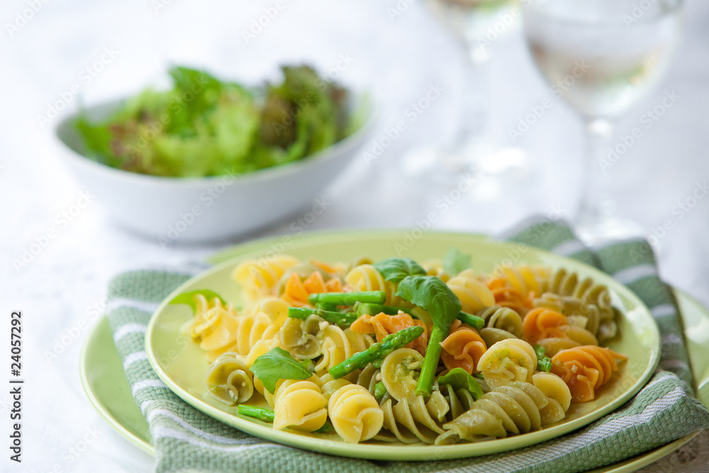Plate of delicious pasta with asparagus and basil pesto Plate of delicious pasta with asparagus and basil pesto