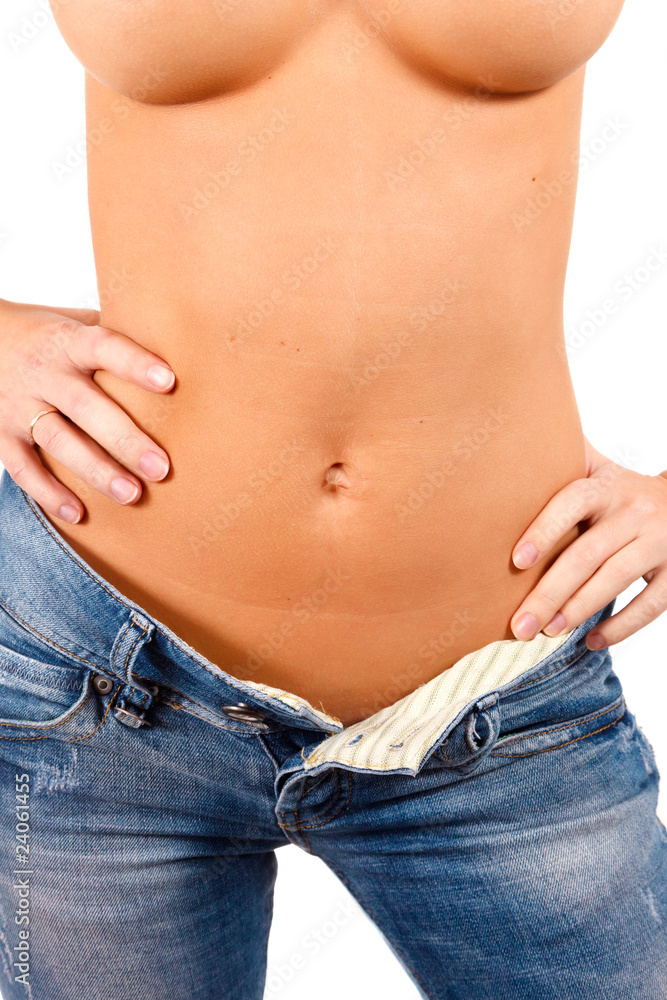 Fototapeta premium Torso of a girl in blue jeans