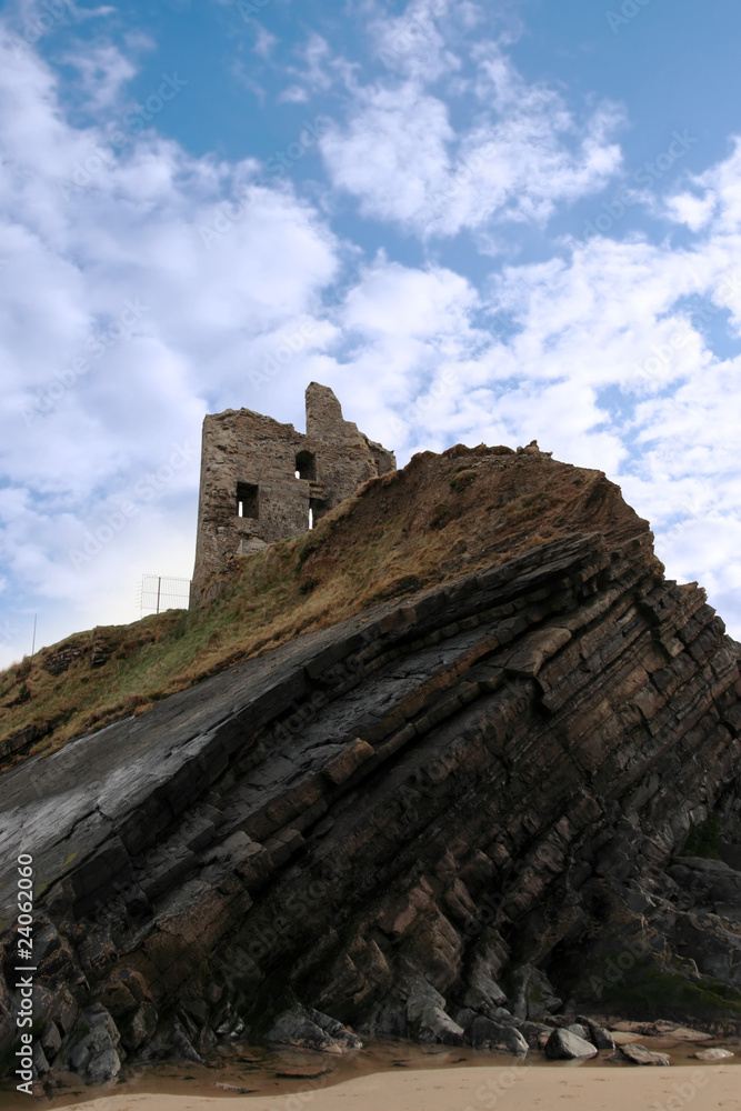 castle tower on a high layered cliff