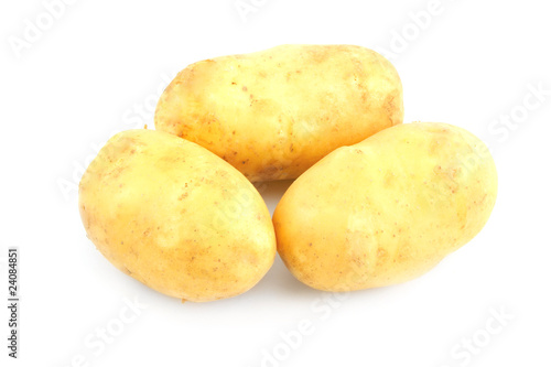 Three raw potatoes isolated on white background