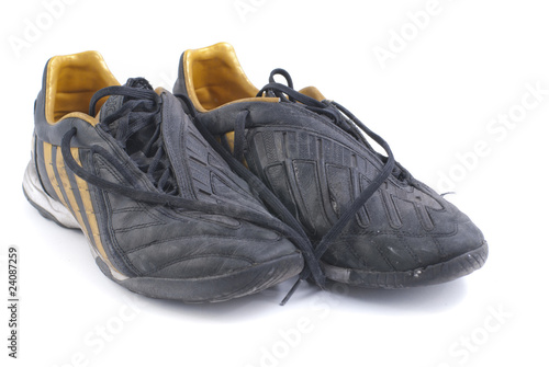 two old black soccer shoes