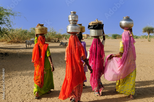 Ethnic women going for the water in well on the desert #24096840