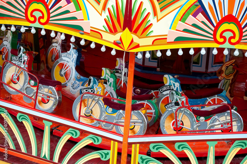 colorful motorcycle themed vintage fairground ride