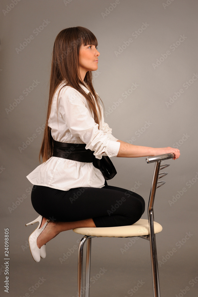 swoman sitting on a chair swoman sitting on a chair