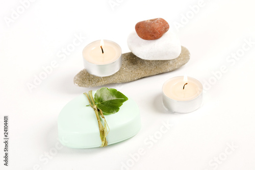 green soap, candle and colored stones