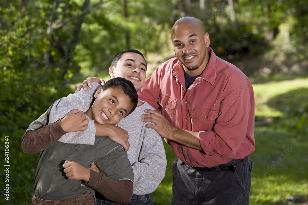 Portrait of Hispanic family with two boys outdoors Portrait of Hispanic family with two boys outdoors