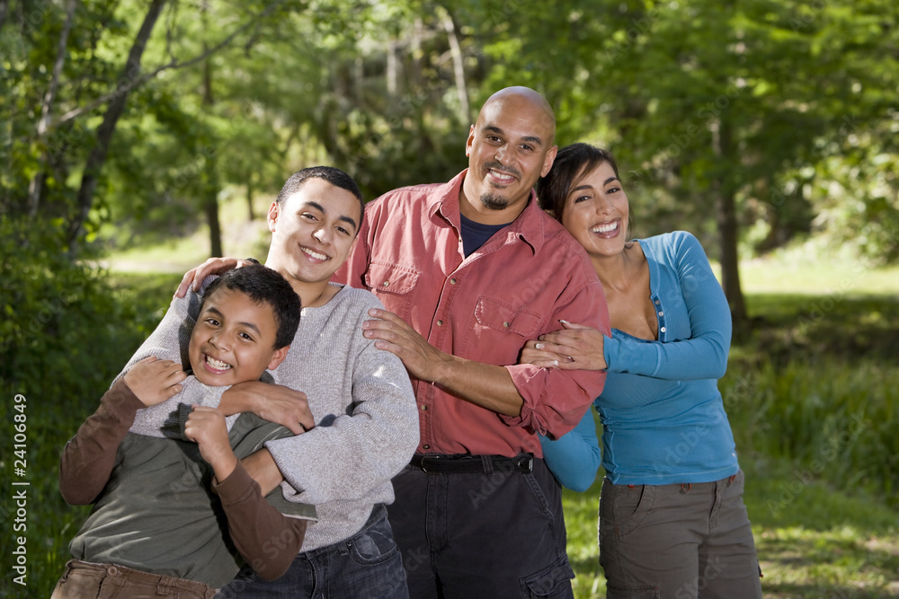 Portrait of Hispanic family with two boys outdoors Portrait of Hispanic family with two boys outdoors