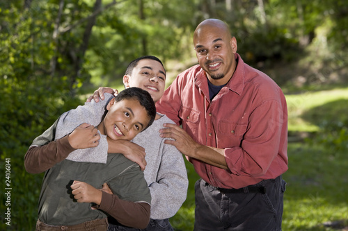 Portrait of Hispanic family with two boys outdoors © Kablonk Micro
