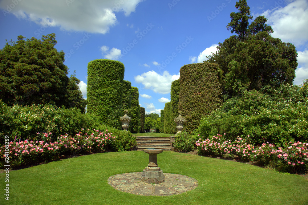 English garden with rose border and sundial
