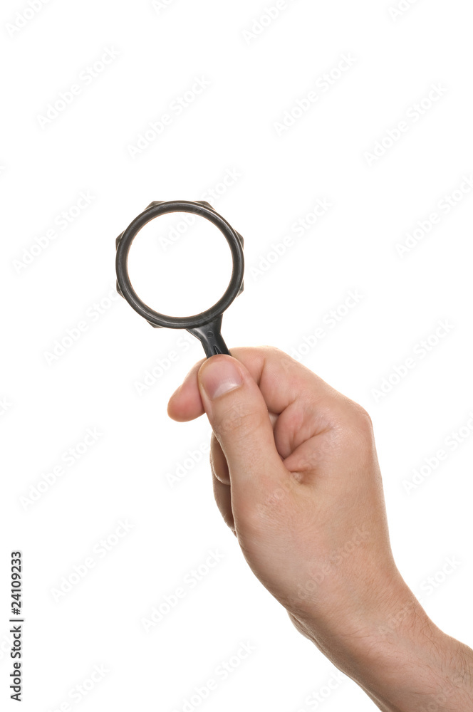 hand with a magnifying glass isolated over white hand with a magnifying glass isolated over white