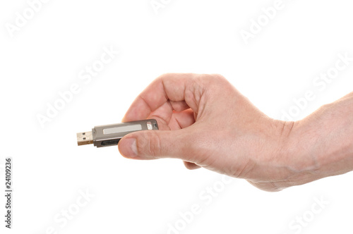 hand with a USB flash isolated over white