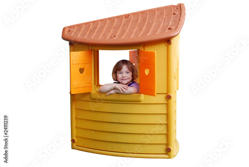 little girl in playhouse toy isolated