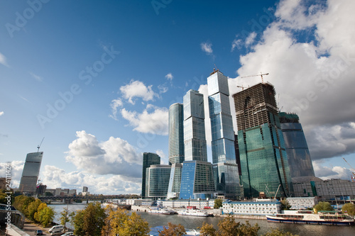 Many scyscrapers of Moscow city under blue sky photo