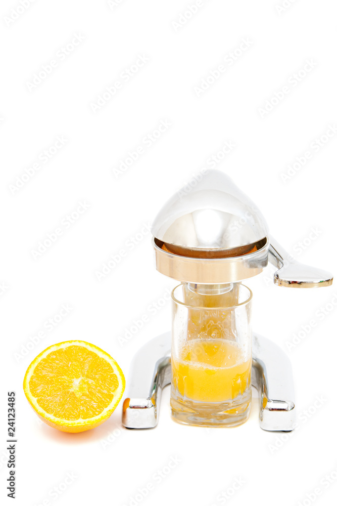 making the orange juice. old metal juicer making the orange juice. old metal juicer