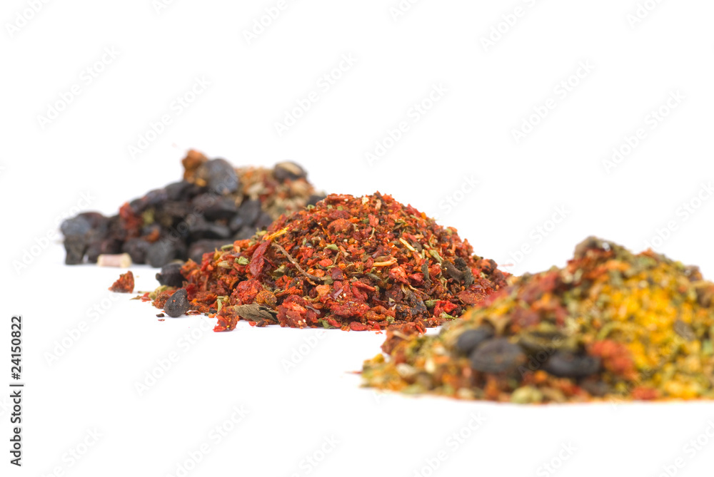 Heaps of various ground spices on white background Heaps of various ground spices on white background