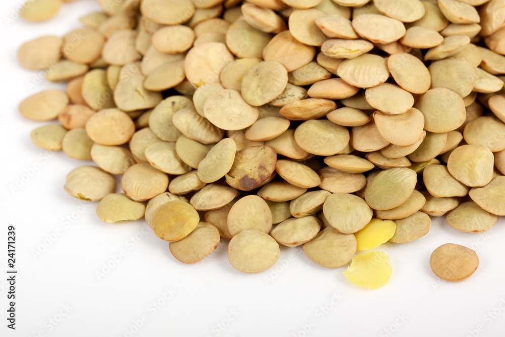Lentil scattered on white background close up view Lentil scattered on white background close up view