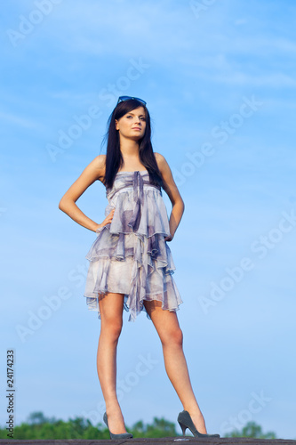 Young woman resting on residential building roof