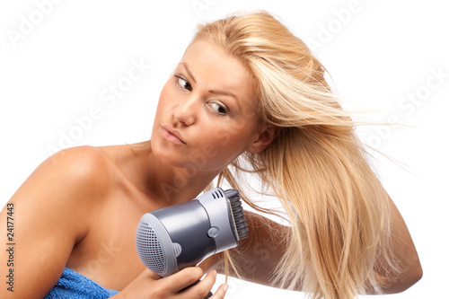 Blonde beauty with hair drier