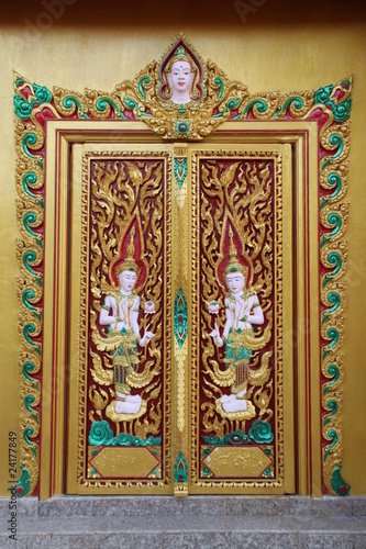 art carving on door of temple, Wat Rahan, Ban Dan, Buriram © netsuthep