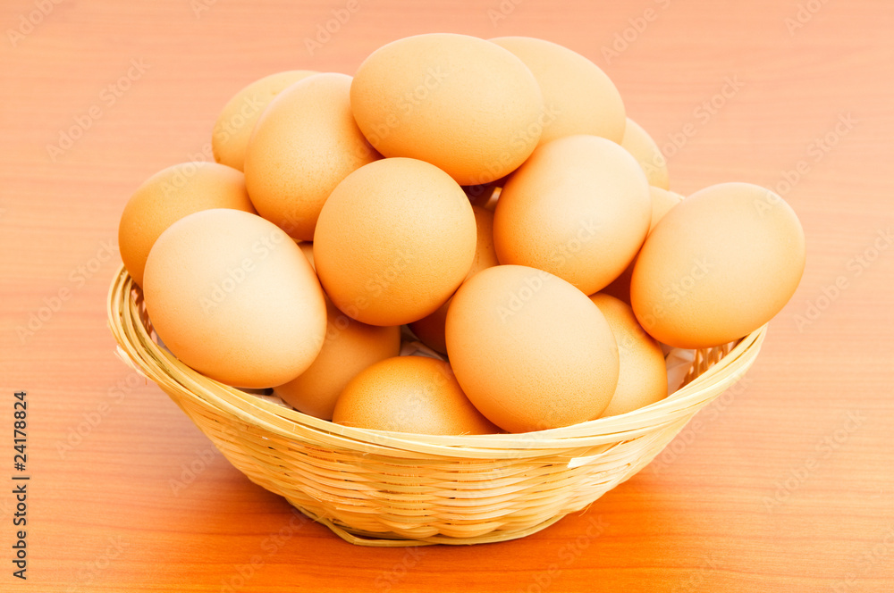 Basket of eggs on the colourful background Basket of eggs on the colourful background