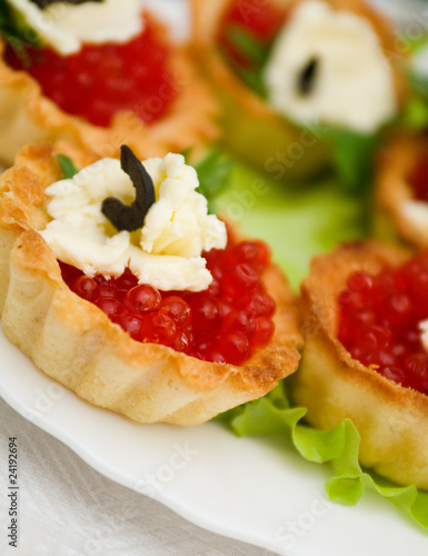 Canapes with red caviar