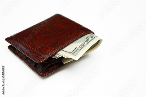 Wallet full of money. Isolated on white.