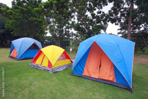 Row of tents for camping on grass © happystock
