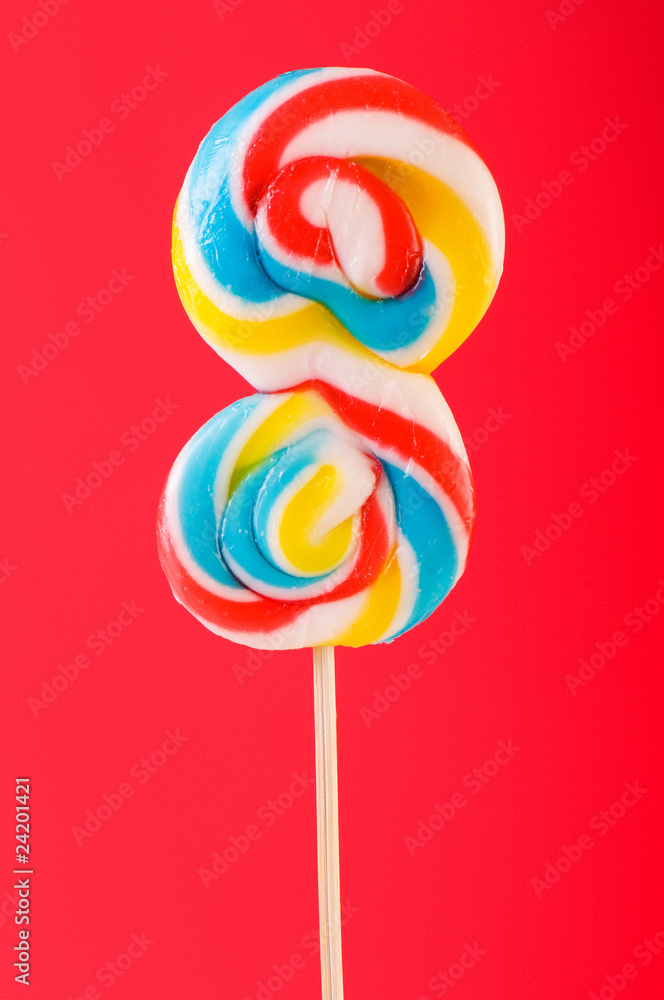 Colourful lollipop against the colourful background Colourful lollipop against the colourful background