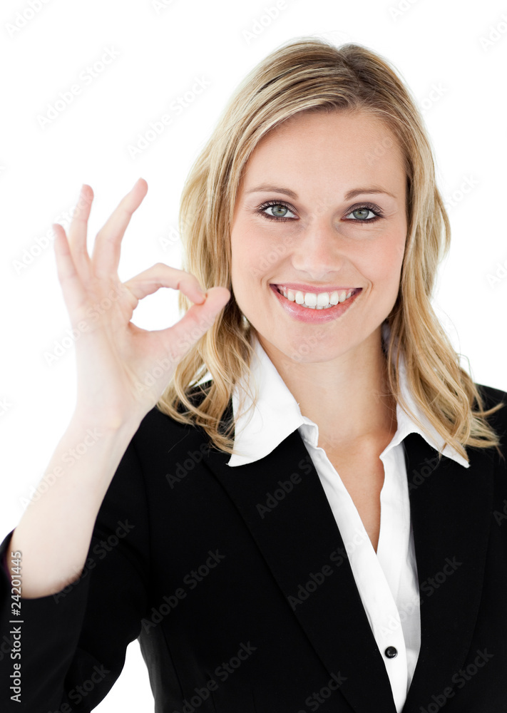 Confident young businesswoman showing OK sign Confident young businesswoman showing OK sign