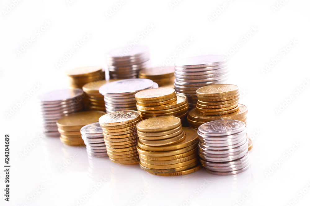 Many coins in column isolated on white Many coins in column isolated on white