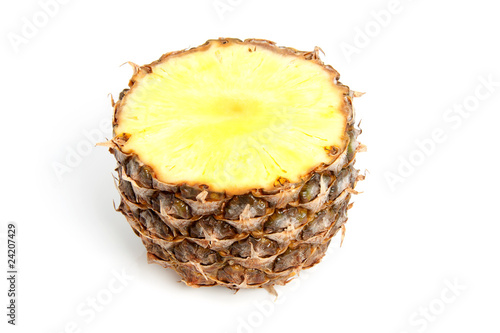 Half cut pineapple over white background